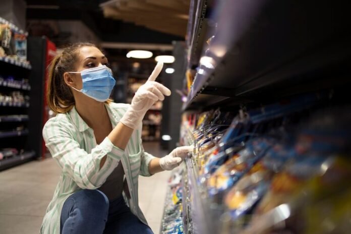 female-person-with-mask-gloves-buying-food-supermarket_342744-1154